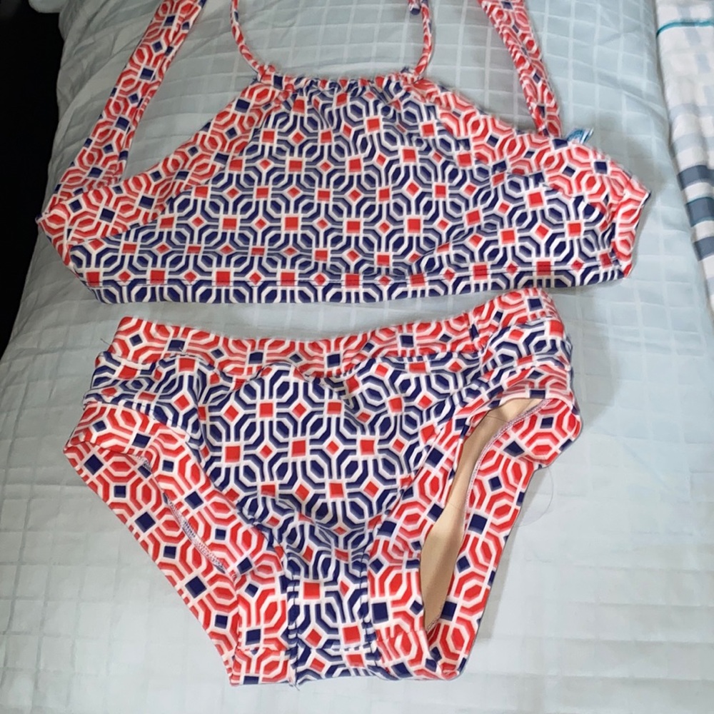 Red/orange (I think orange) and blue squirtini bikini.